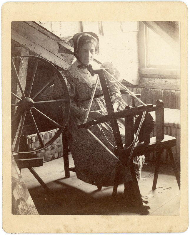 Woman at a spinner's weasel 3