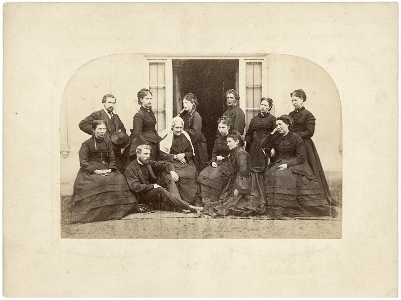 Group in dark clothes, possibly Scottish 6